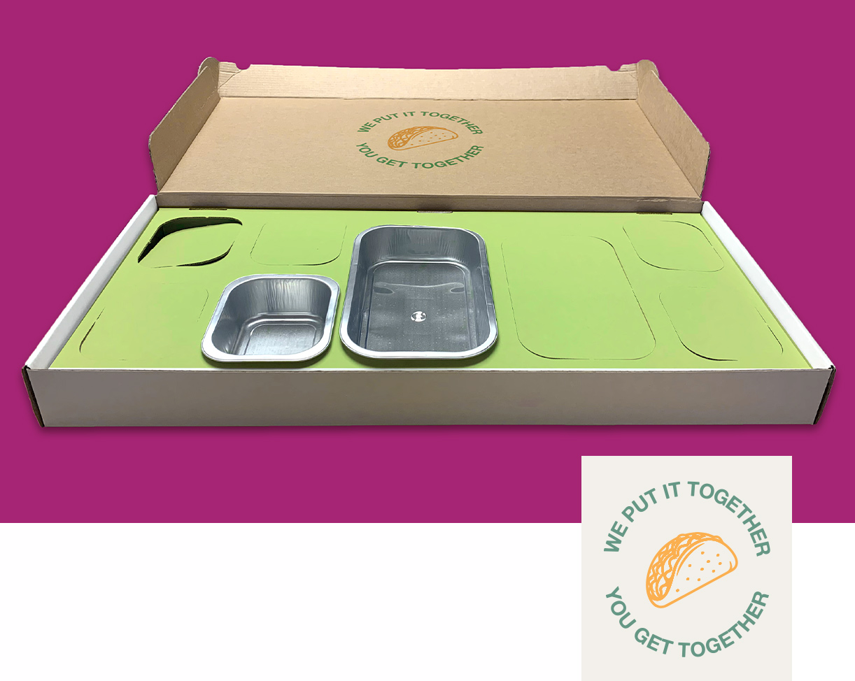 Open food catering boxes designed for a mexican fiesta kit