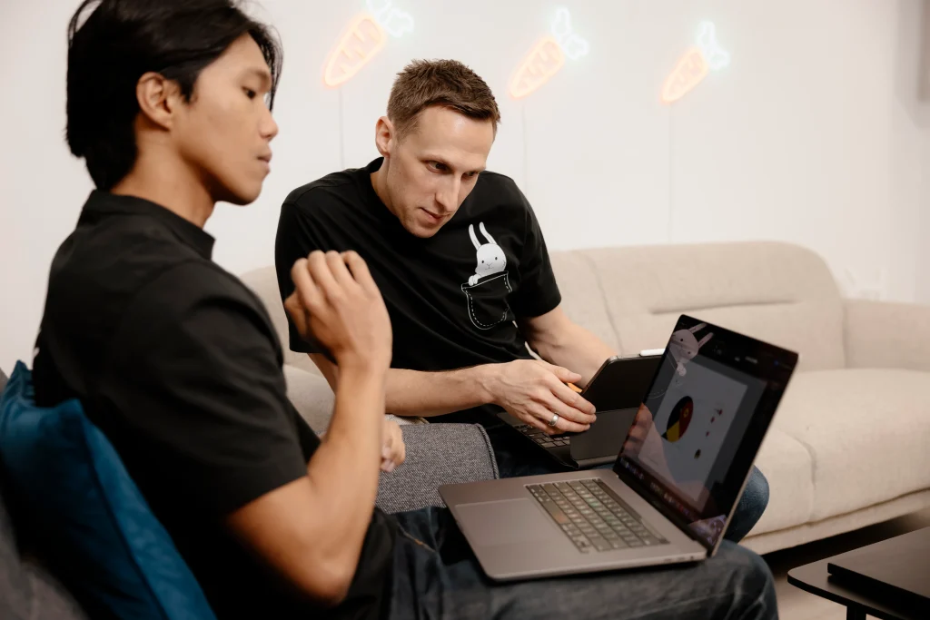 White Rabbit team analyzing client project on laptop